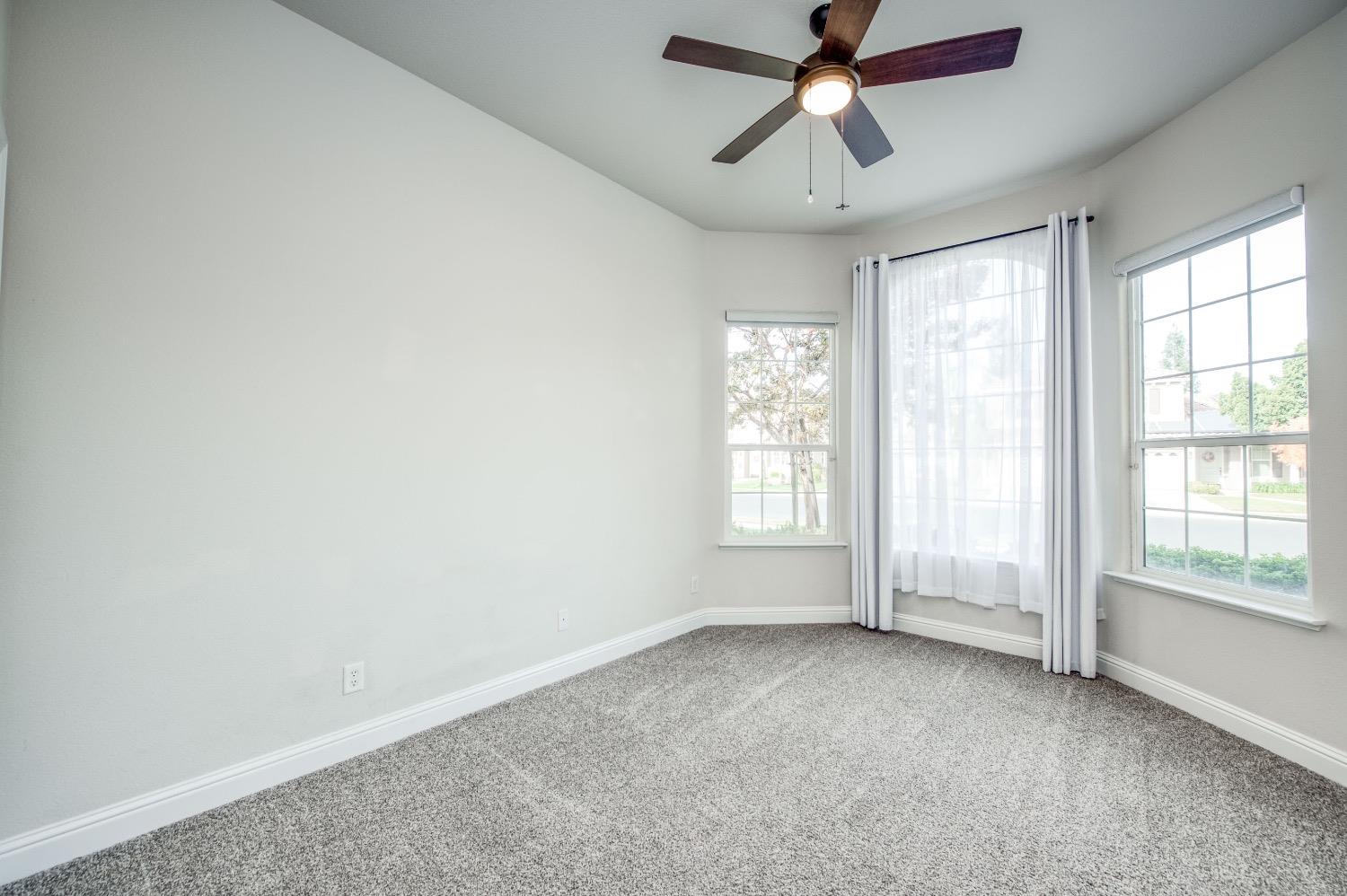 3252 Everglade Avenue Clovis, CA 93619 - Photo 21 of 31 a view of an empty room with a window