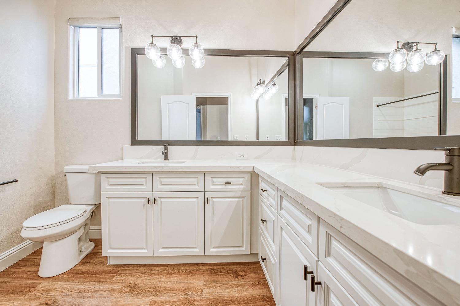 3252 Everglade Avenue Clovis, CA 93619 - Photo 23 of 31 a bathroom with a sink and a toilet