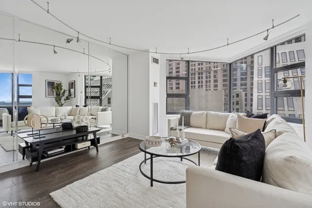a living room with furniture and a table