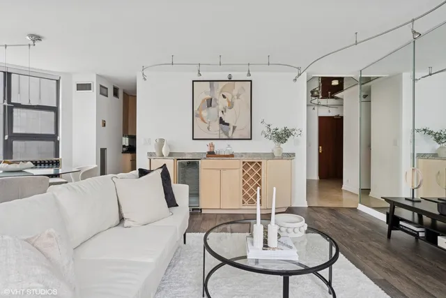 a living room with furniture and a table