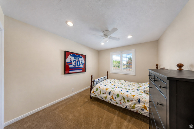 9990 Albury Road Sandy, UT 84092 - Photo 26 of 36 Carpeted room featuring a ceiling fan, recessed lighting, and a window with white louvered shutters