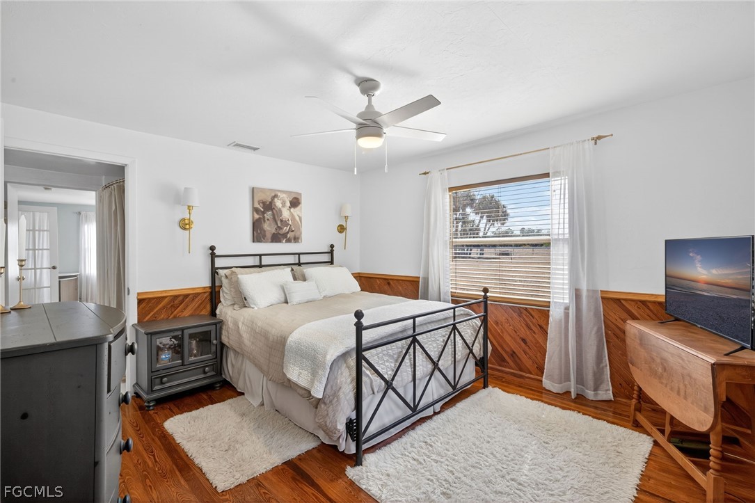 3790 Goggin Road Alva, FL 33920 - Photo 14 of 38 a bedroom with a bed and a flat screen tv