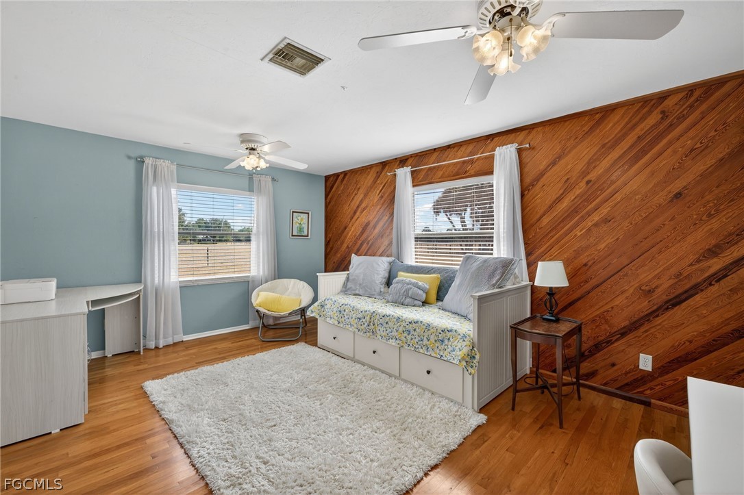 3790 Goggin Road Alva, FL 33920 - Photo 17 of 38 a bedroom with furniture and wooden floor