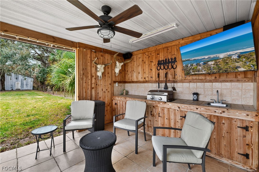 3790 Goggin Road Alva, FL 33920 - Photo 18 of 38 a view of a kitchen with furniture and a fireplace