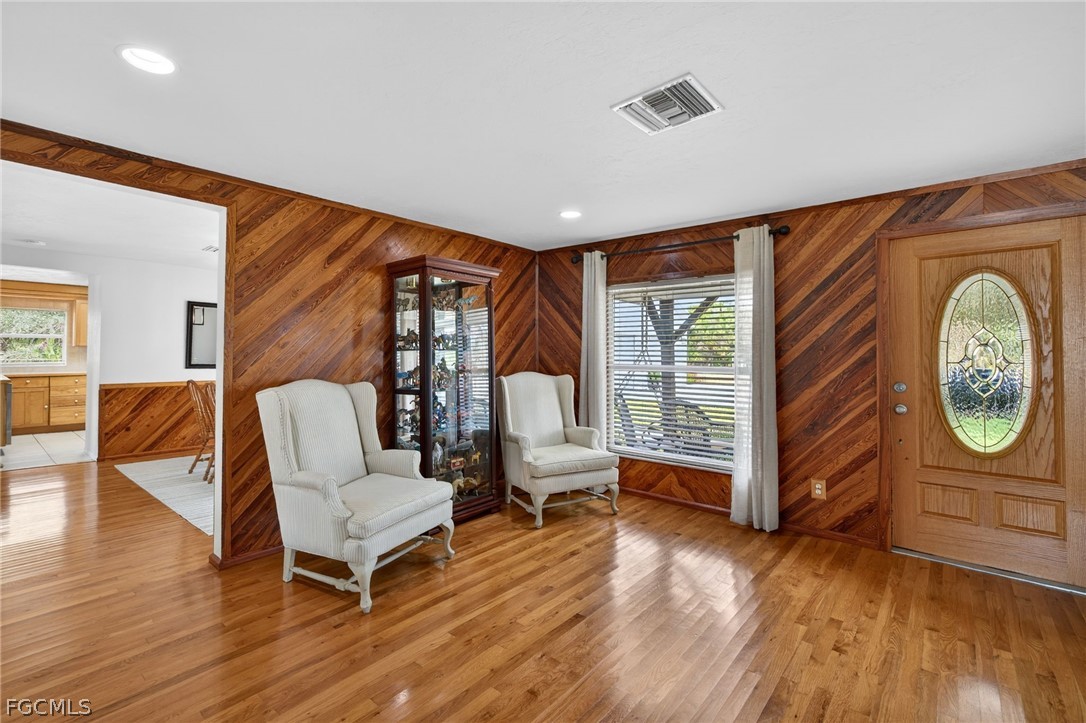 3790 Goggin Road Alva, FL 33920 - Photo 2 of 38 a living room with furniture a wooden floor and a large window