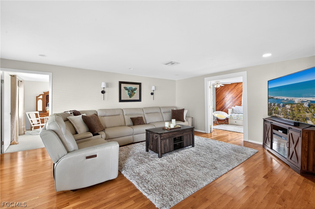 3790 Goggin Road Alva, FL 33920 - Photo 4 of 38 a living room with furniture and a flat screen tv