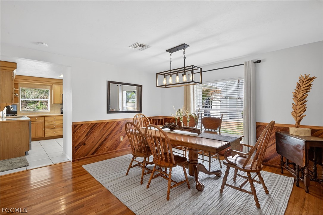 3790 Goggin Road Alva, FL 33920 - Photo 5 of 38 a view of a dining room with furniture and wooden floor