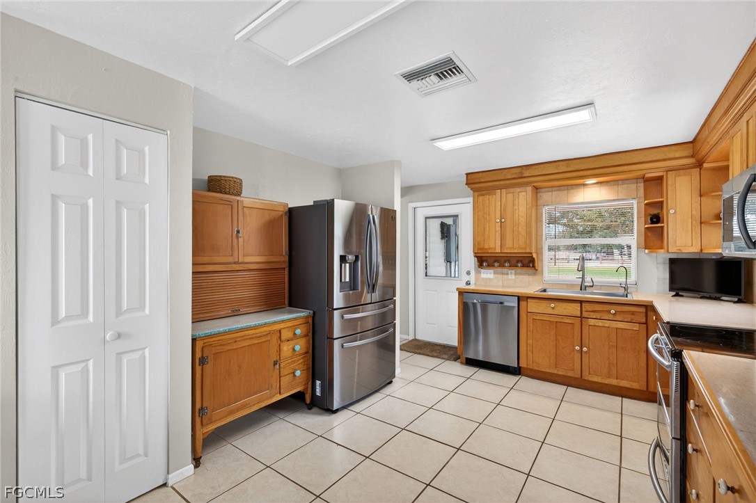 3790 Goggin Road Alva, FL 33920 - Photo 8 of 38 a kitchen with appliances cabinets and furniture