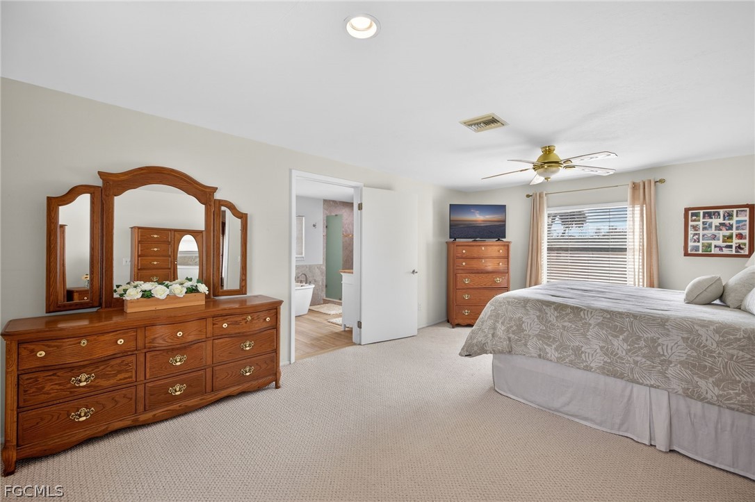 3790 Goggin Road Alva, FL 33920 - Photo 10 of 38 a bedroom with a bed and a dresser