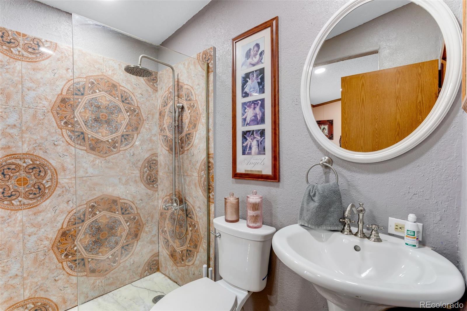 6310 West Co Road 4 Berthoud, CO 80513 - Photo 21 of 49 a bathroom with a sink and a mirror