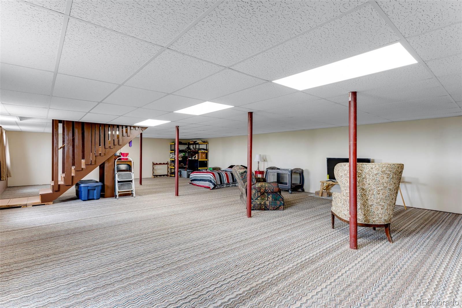 6310 West Co Road 4 Berthoud, CO 80513 - Photo 25 of 49 a living room with furniture and a wooden floor