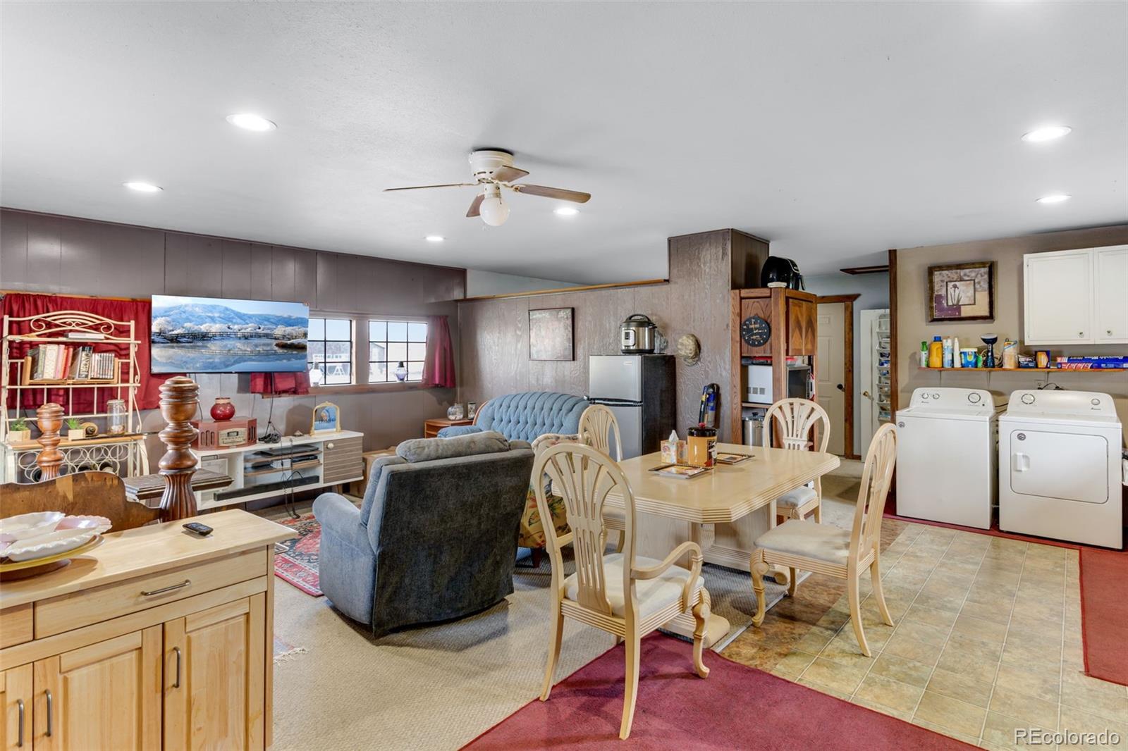 6310 West Co Road 4 Berthoud, CO 80513 - Photo 29 of 49 a view of a dining room with furniture and wooden floor
