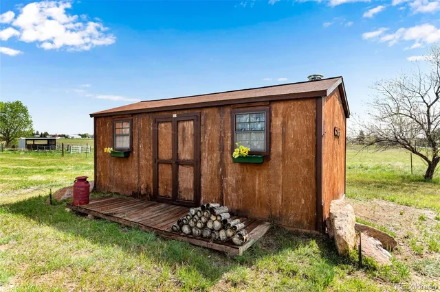 a living room with furniture a flat screen tv and a couch