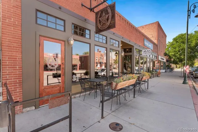 an aerial view of a house with a garden and lake view