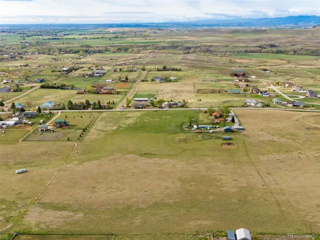 a aerial view of residential houses with outdoor space