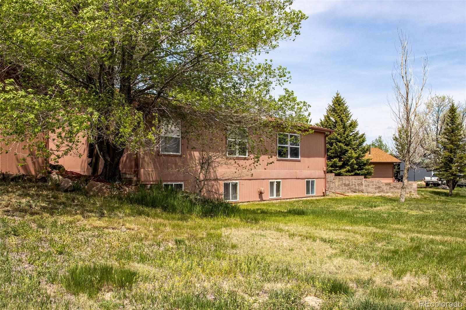 6310 West Co Road 4 Berthoud, CO 80513 - Photo 48 of 49 a house view with swimming pool in front of it