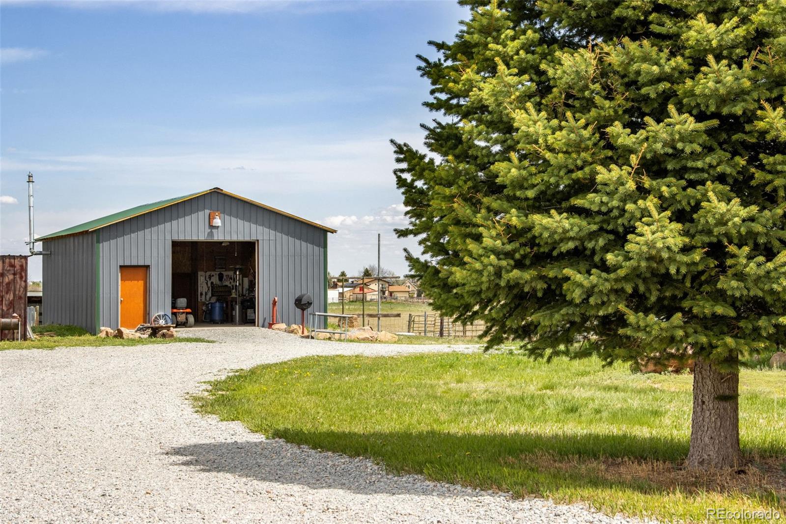 6310 West Co Road 4 Berthoud, CO 80513 - Photo 7 of 49 a house view with swimming pool in front of it
