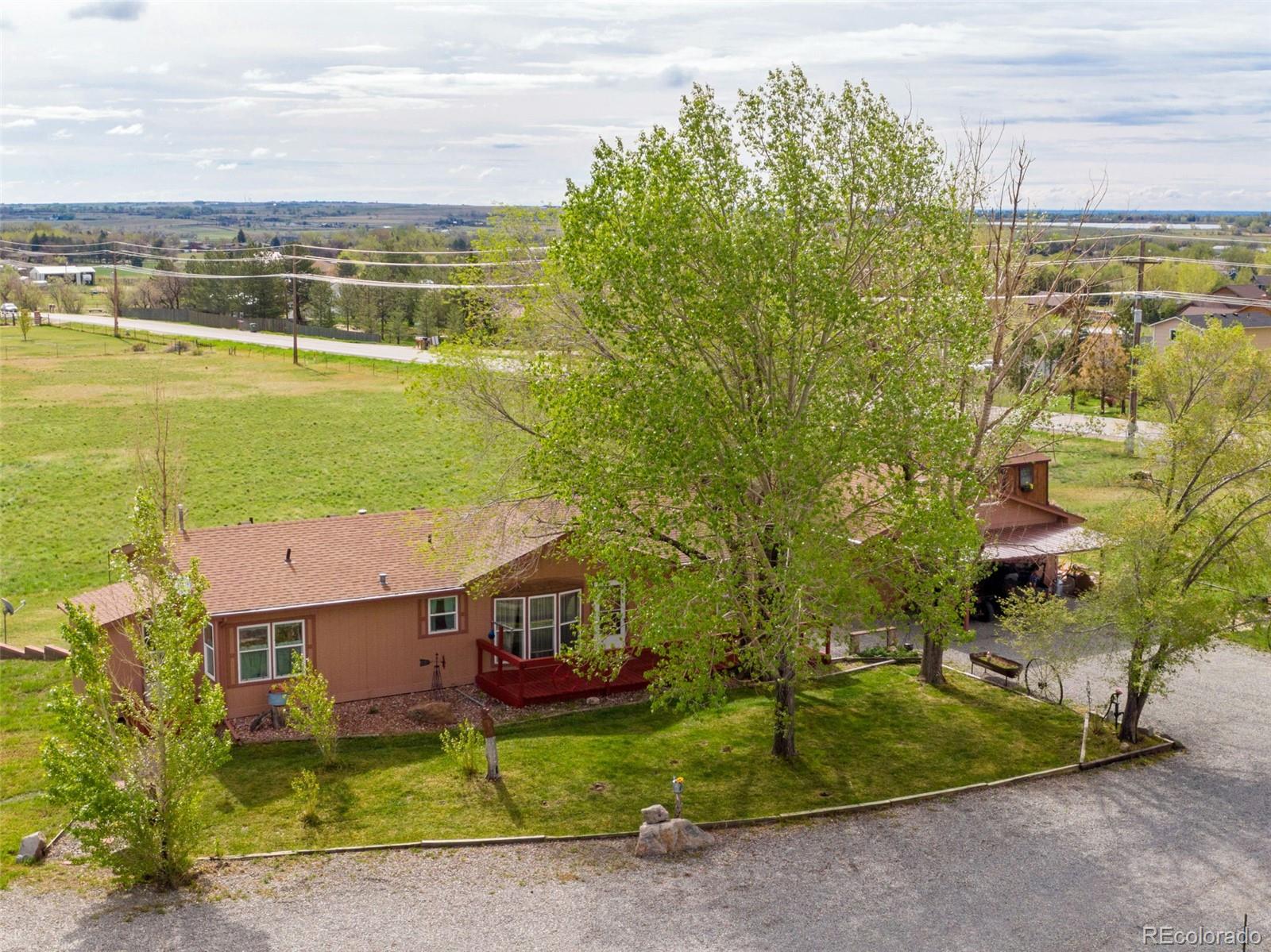 6310 West Co Road 4 Berthoud, CO 80513 - Photo 8 of 49 a view of a patio with a yard