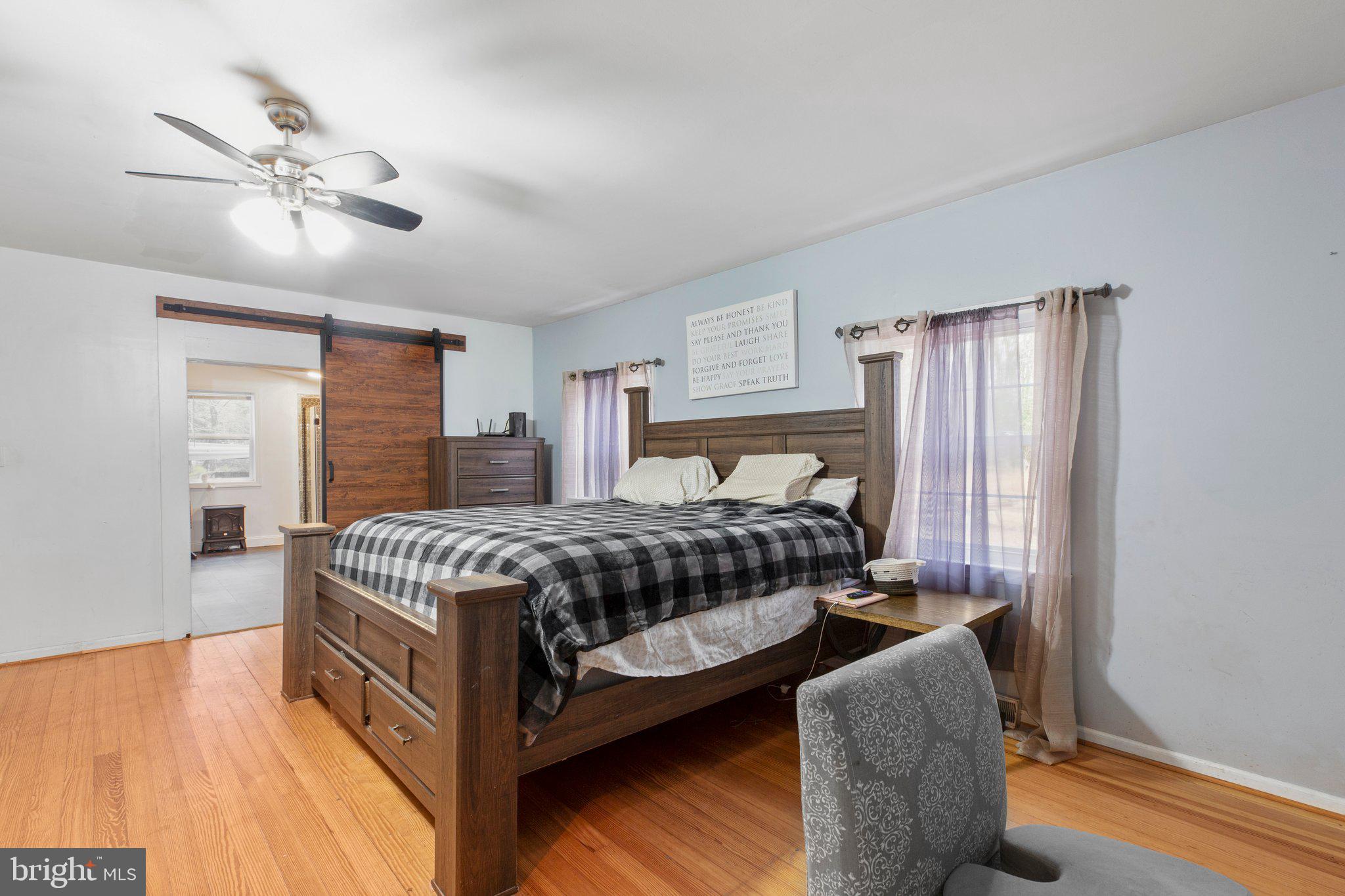 18620 Ridge Road Colonial Beach, VA 22443 - Photo 13 of 39 Primary BR (3) note Barndoor to Primary Bath