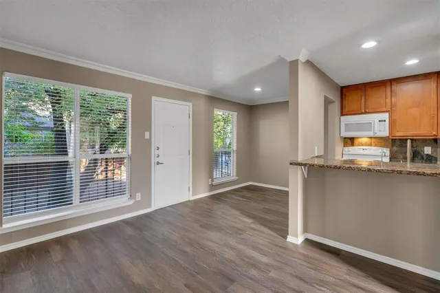 a view of a kitchen with a sink and a window