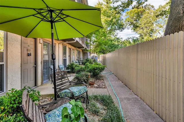 a view of a backyard with potted plants