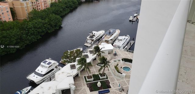 a kitchen with a sink and chandelier