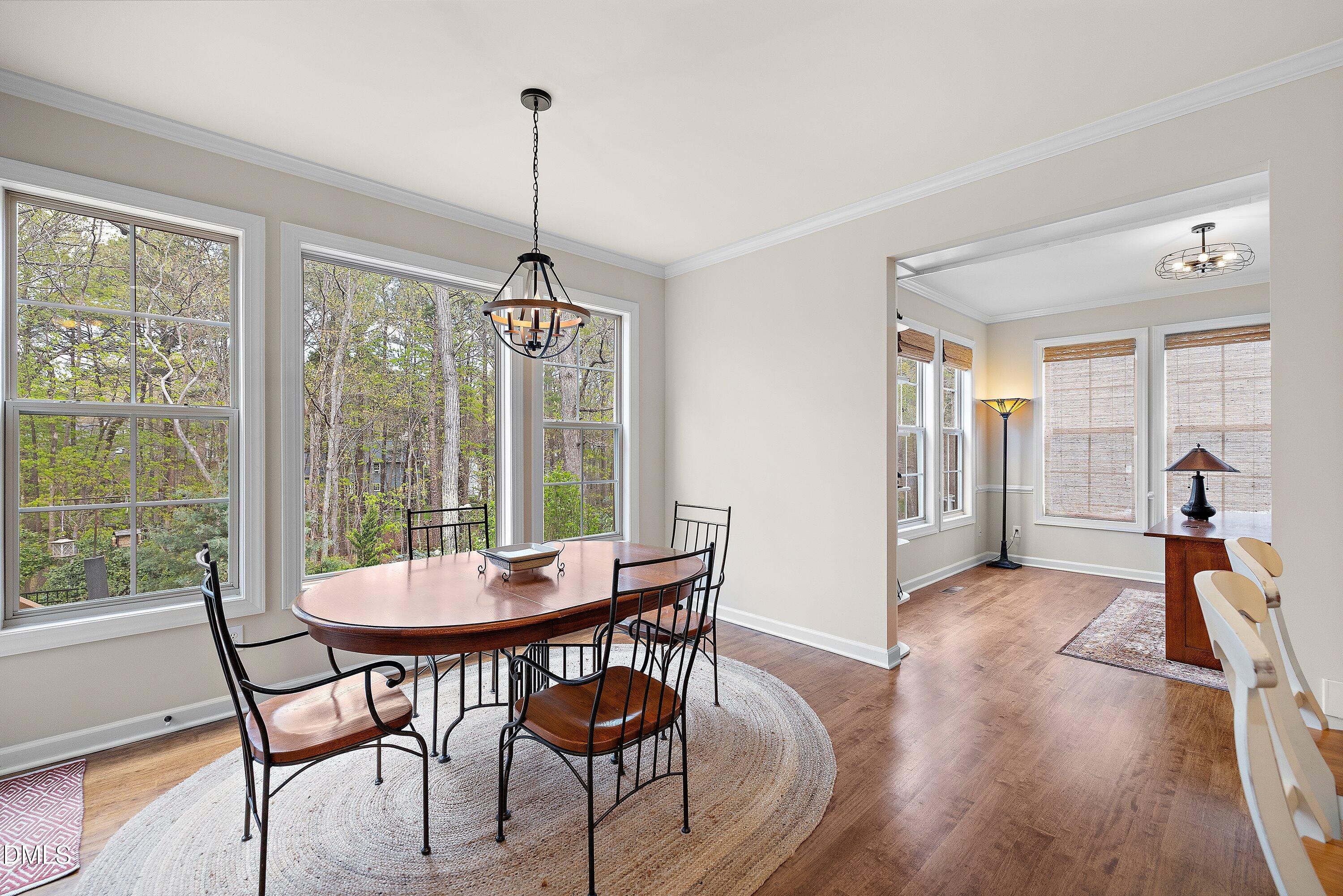 701 Royal Tower Way Cary, NC 27513 - Photo 16 of 82 a view of a dining room with furniture window and wooden floor