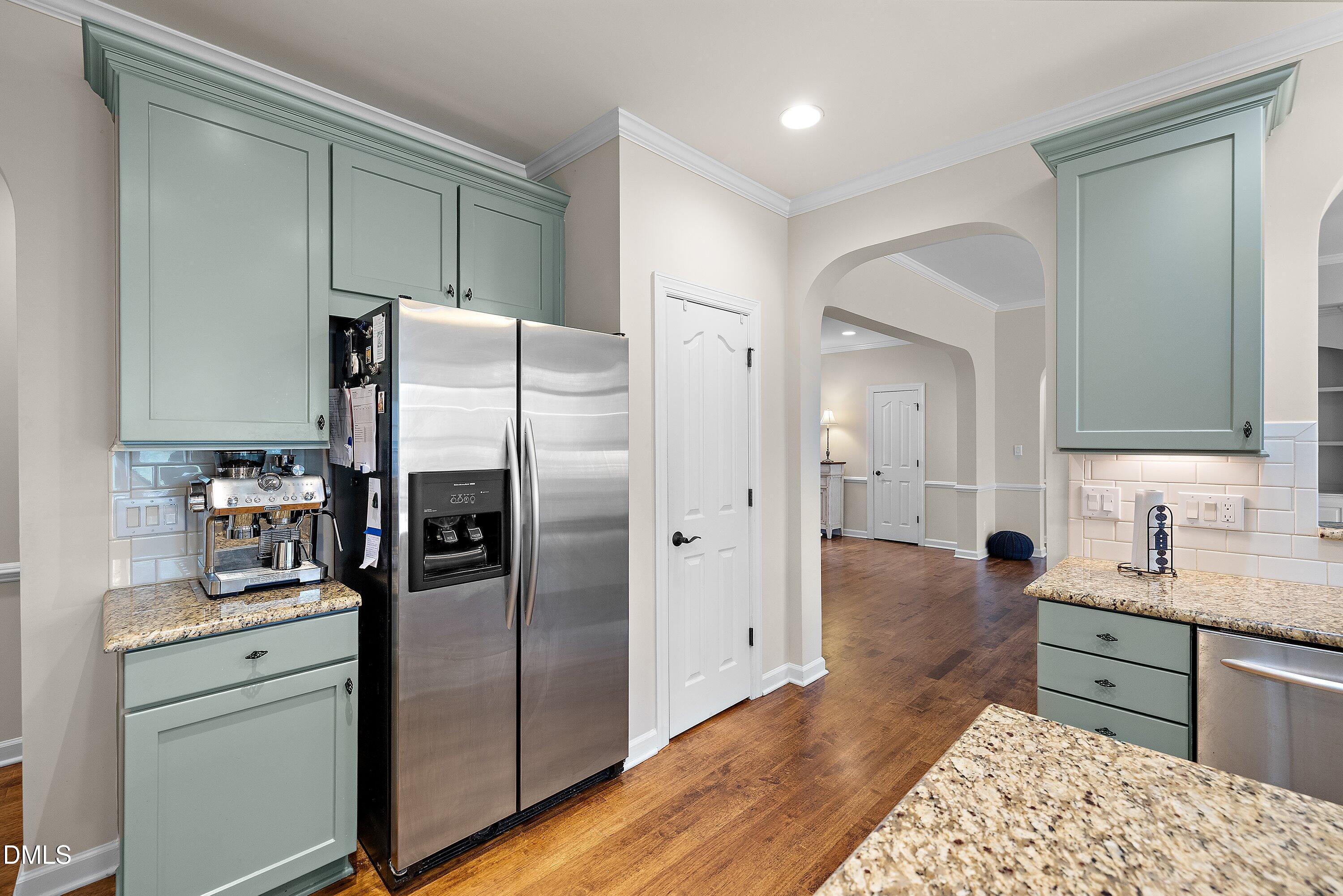 701 Royal Tower Way Cary, NC 27513 - Photo 17 of 82 a kitchen with stainless steel appliances granite countertop a refrigerator and a sink