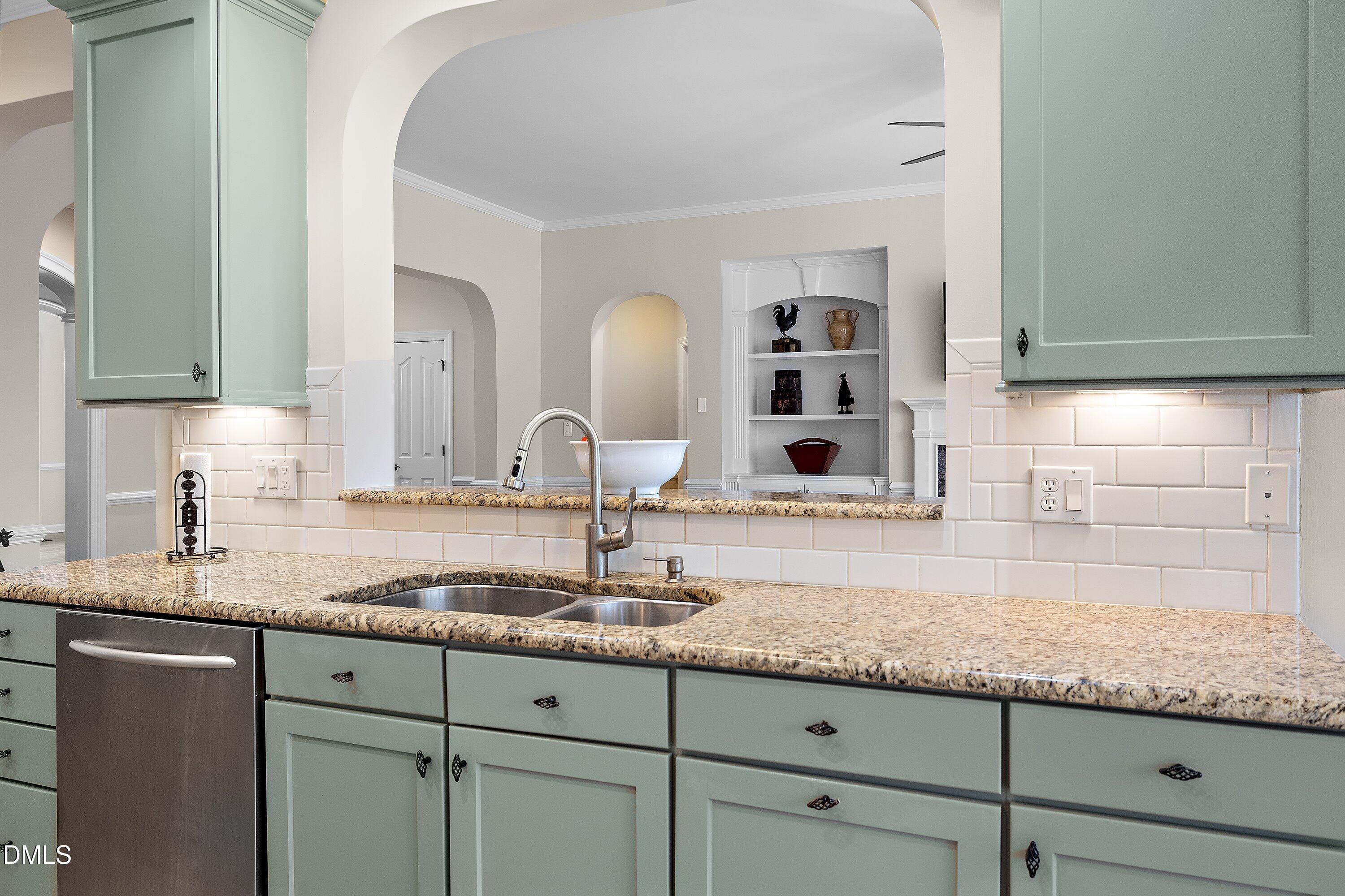 701 Royal Tower Way Cary, NC 27513 - Photo 20 of 82 a kitchen with granite countertop a sink and cabinets
