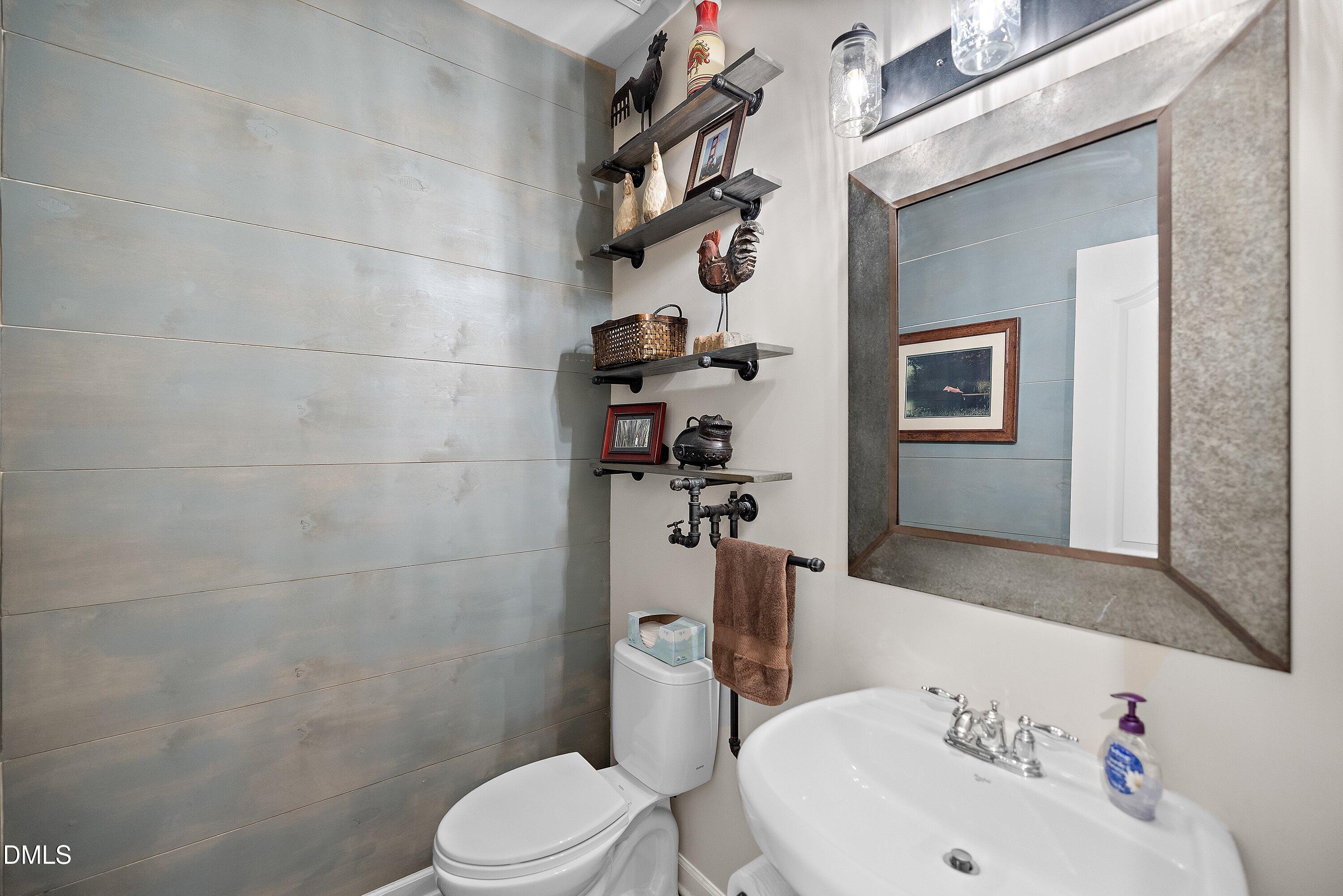 701 Royal Tower Way Cary, NC 27513 - Photo 29 of 82 a bathroom with a sink a toilet and shower