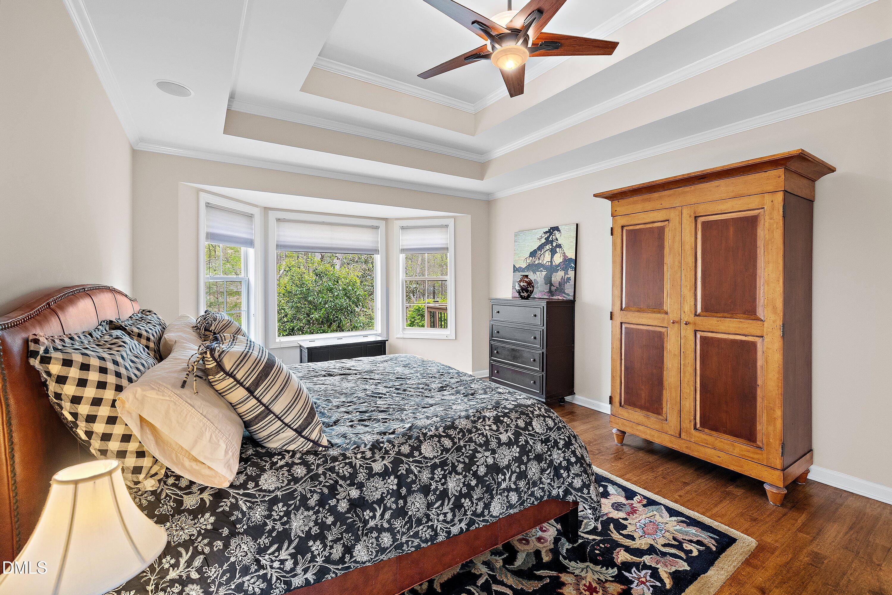701 Royal Tower Way Cary, NC 27513 - Photo 36 of 82 a bed sitting in a spacious bedroom next to a window