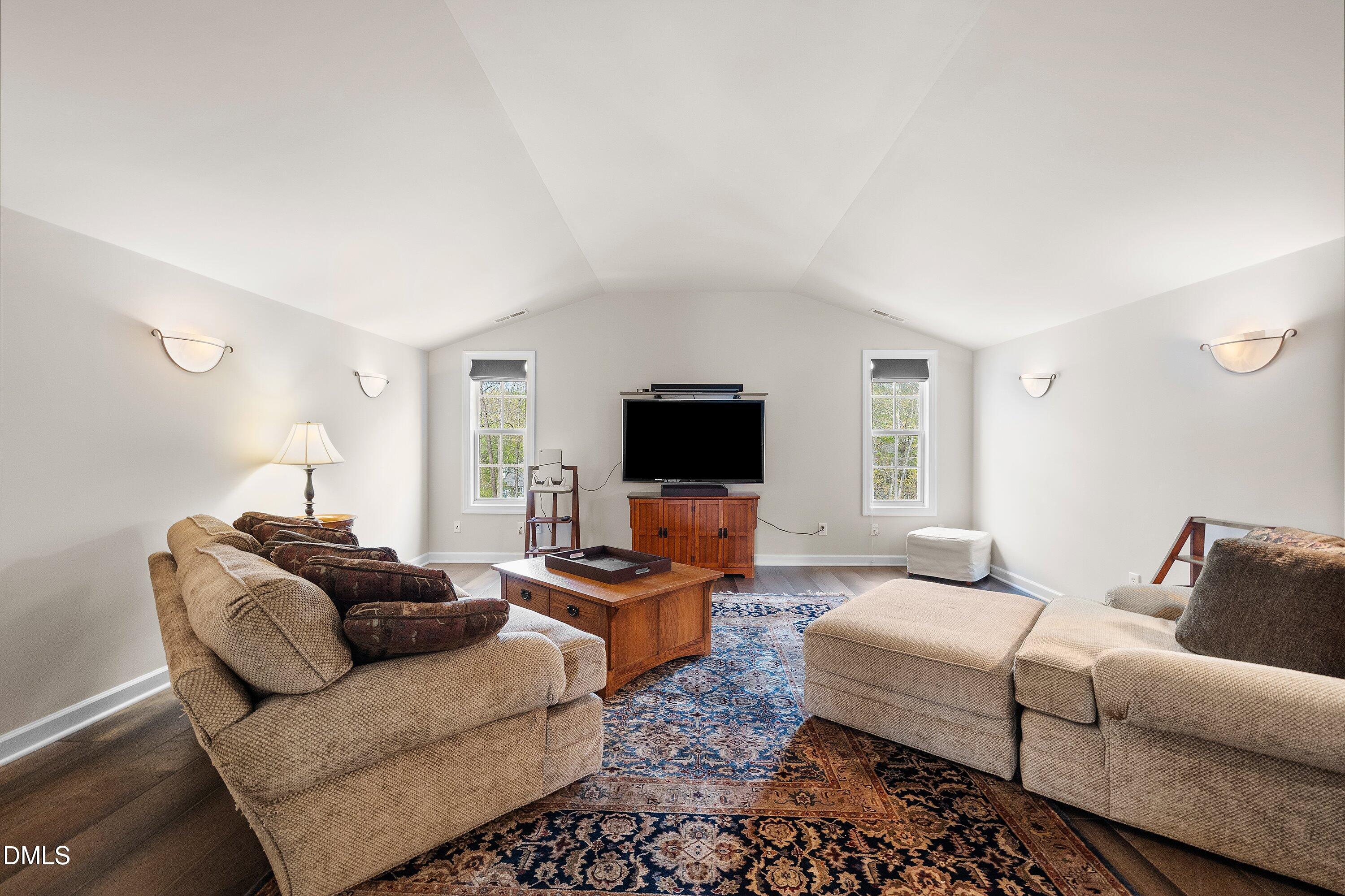 701 Royal Tower Way Cary, NC 27513 - Photo 45 of 82 a living room with furniture and a flat screen tv