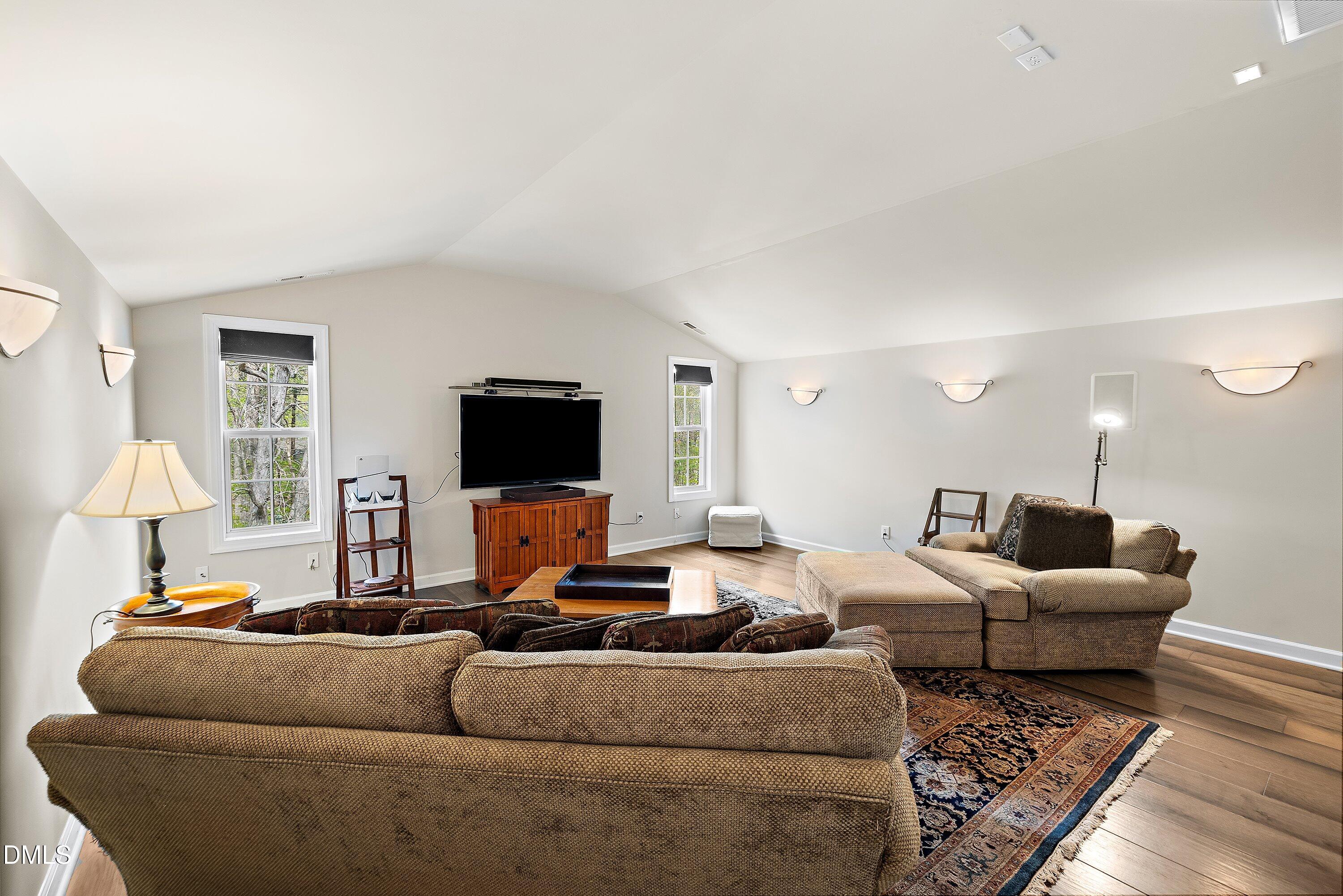 701 Royal Tower Way Cary, NC 27513 - Photo 46 of 82 a living room with furniture and a flat screen tv