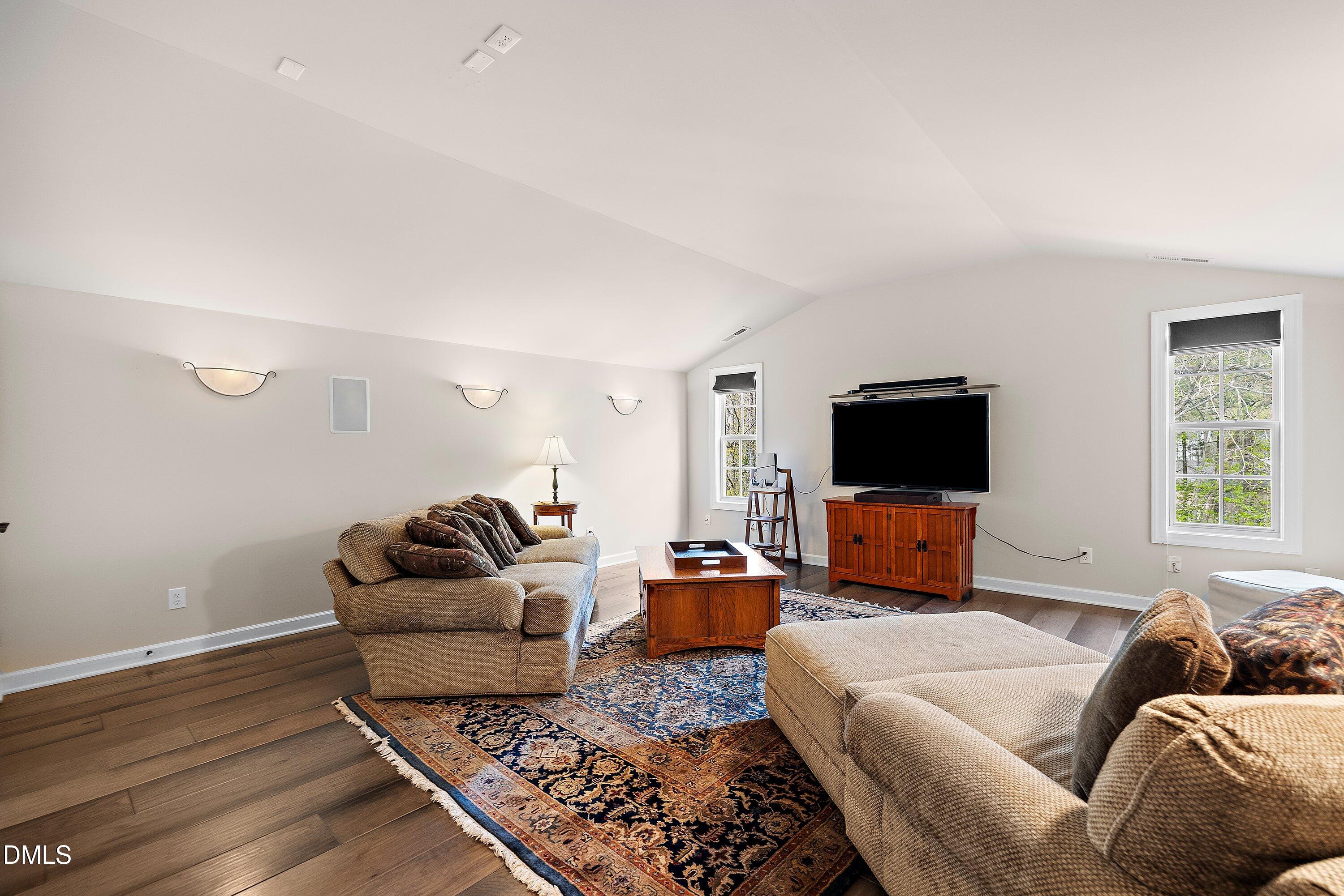 701 Royal Tower Way Cary, NC 27513 - Photo 48 of 82 a living room with furniture and a flat screen tv