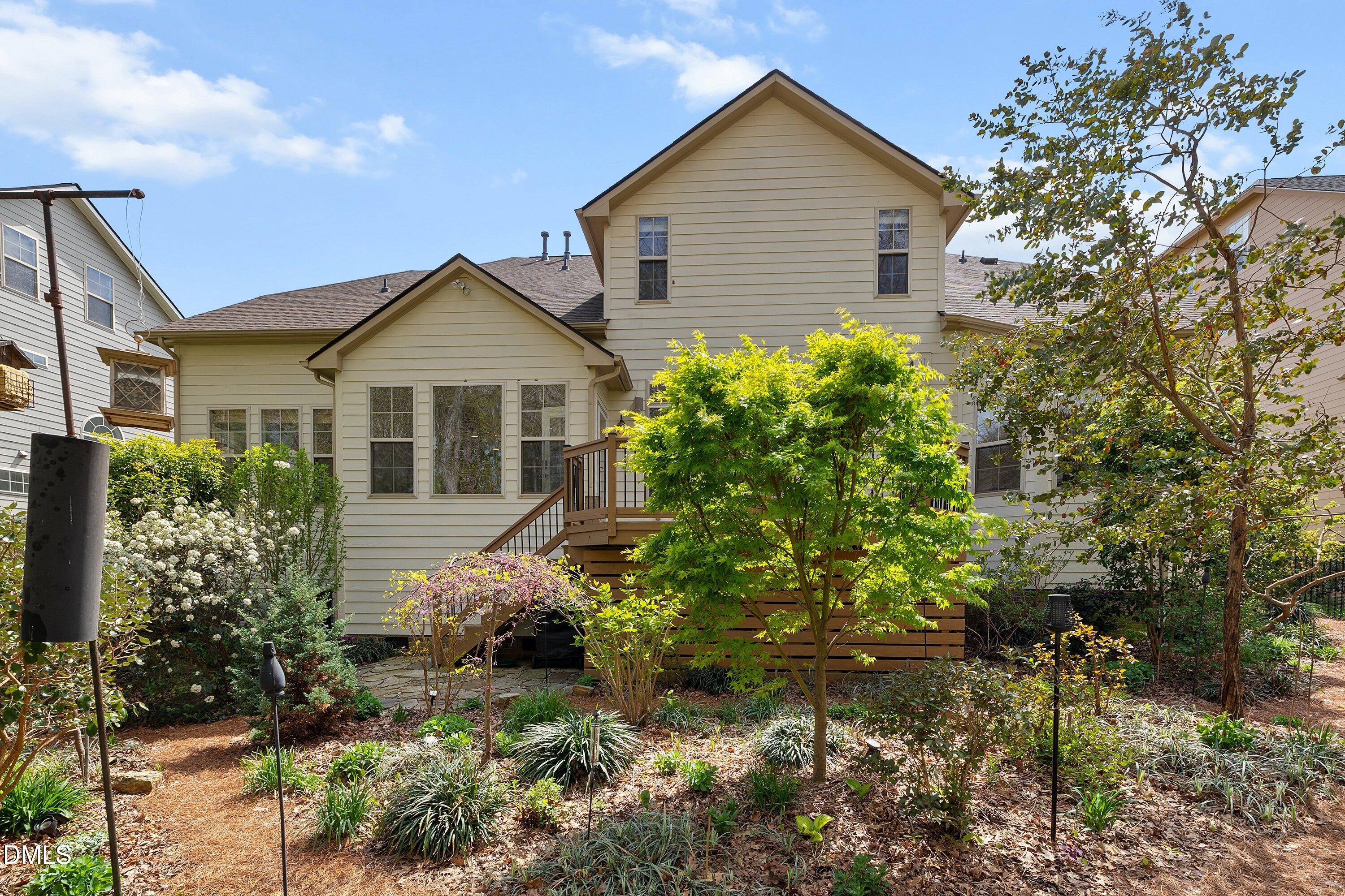 701 Royal Tower Way Cary, NC 27513 - Photo 71 of 82 a front view of a house with a yard and potted plants