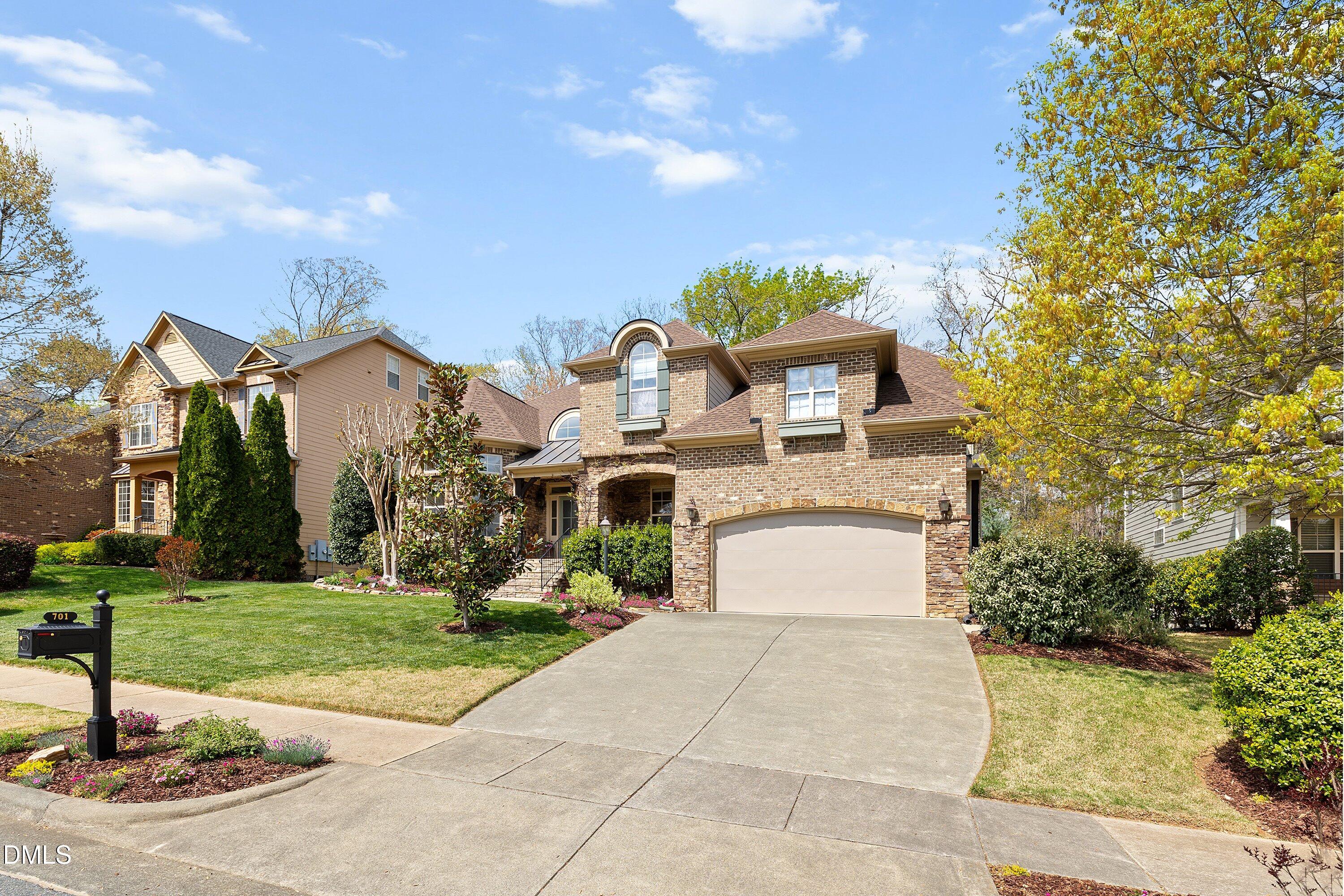 701 Royal Tower Way Cary, NC 27513 - Photo 79 of 82 a front view of a house with garden