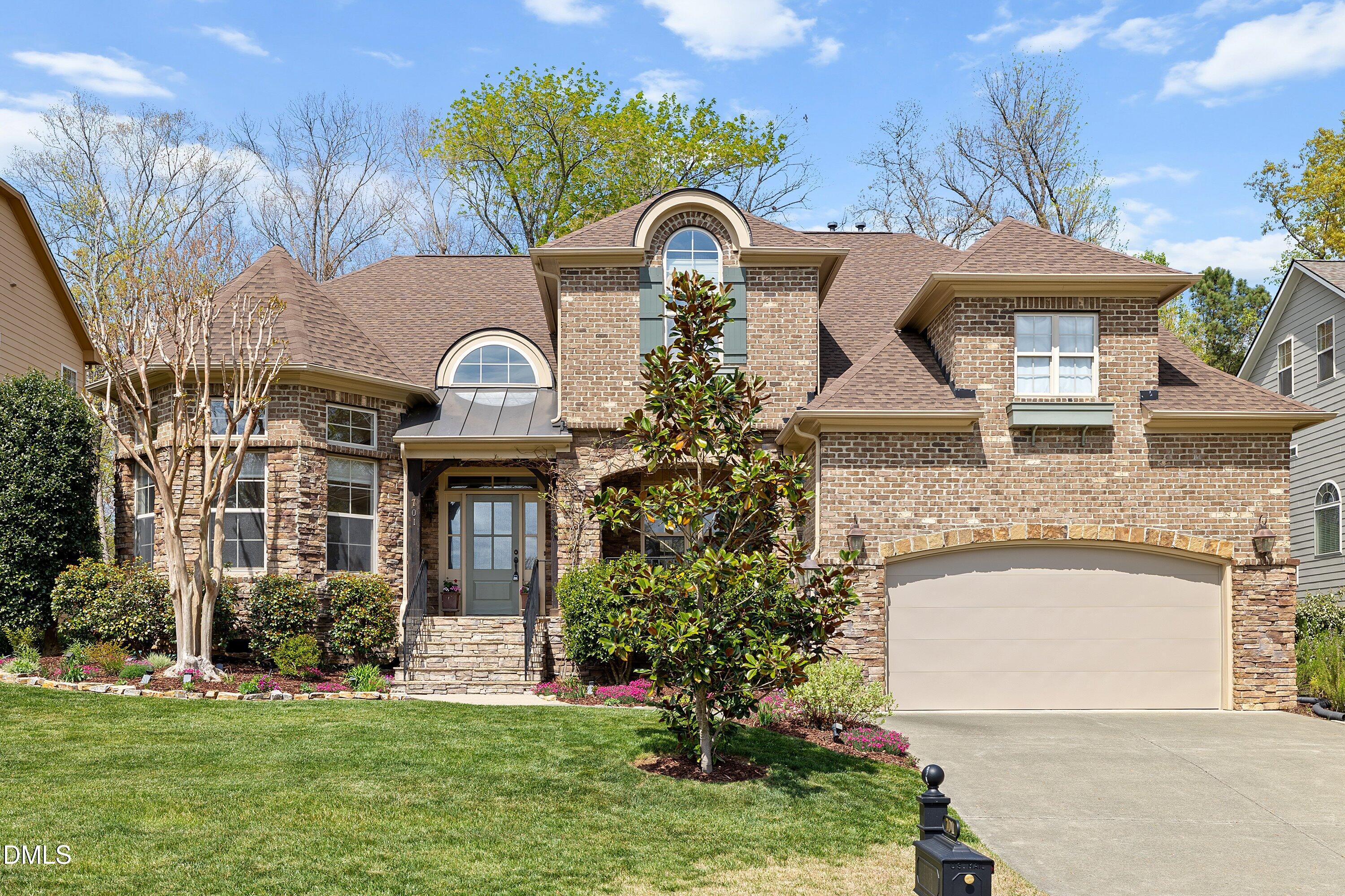 701 Royal Tower Way Cary, NC 27513 - Photo 80 of 82 a front view of a house with a garden