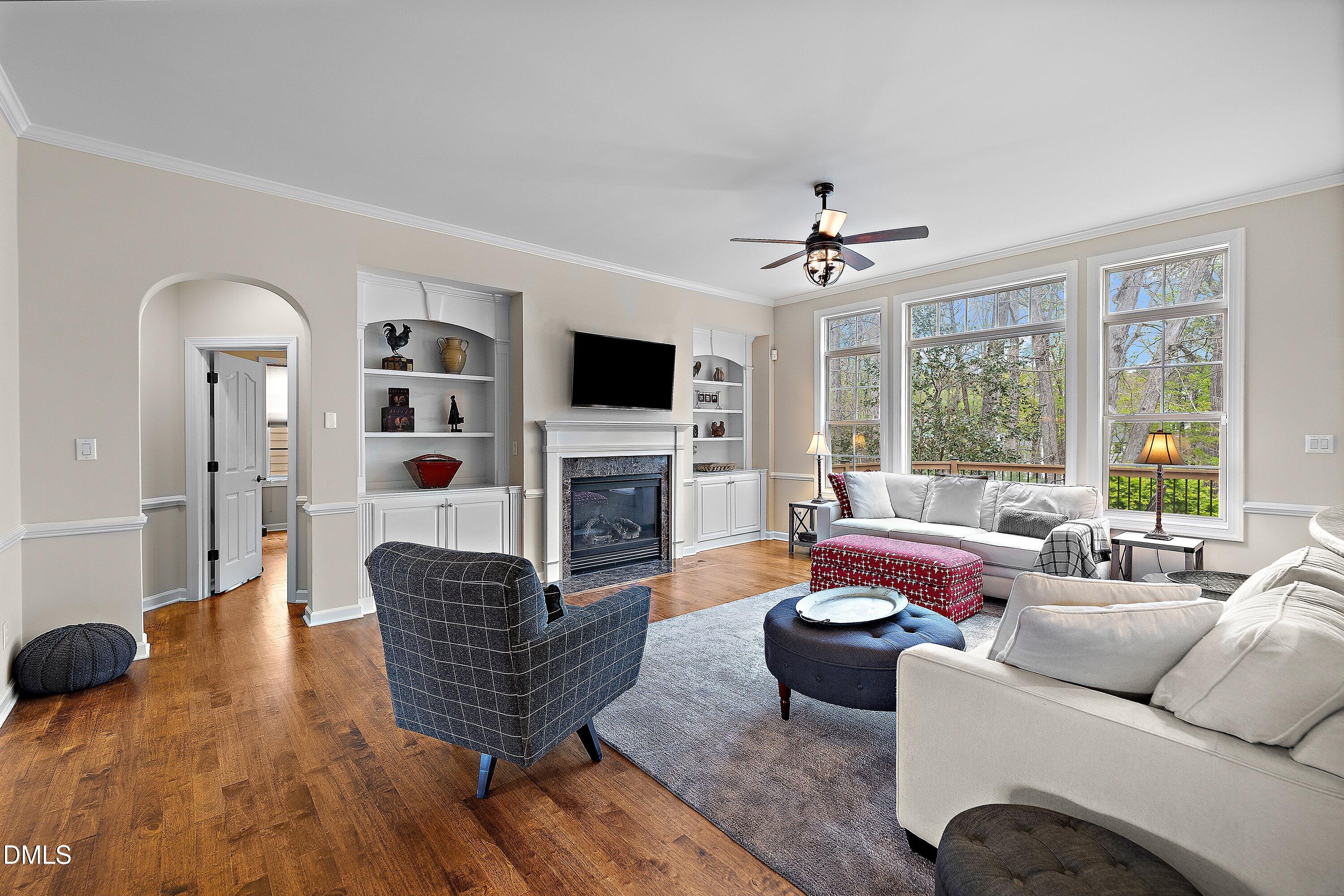 701 Royal Tower Way Cary, NC 27513 - Photo 8 of 82 a living room with furniture fireplace and a large window