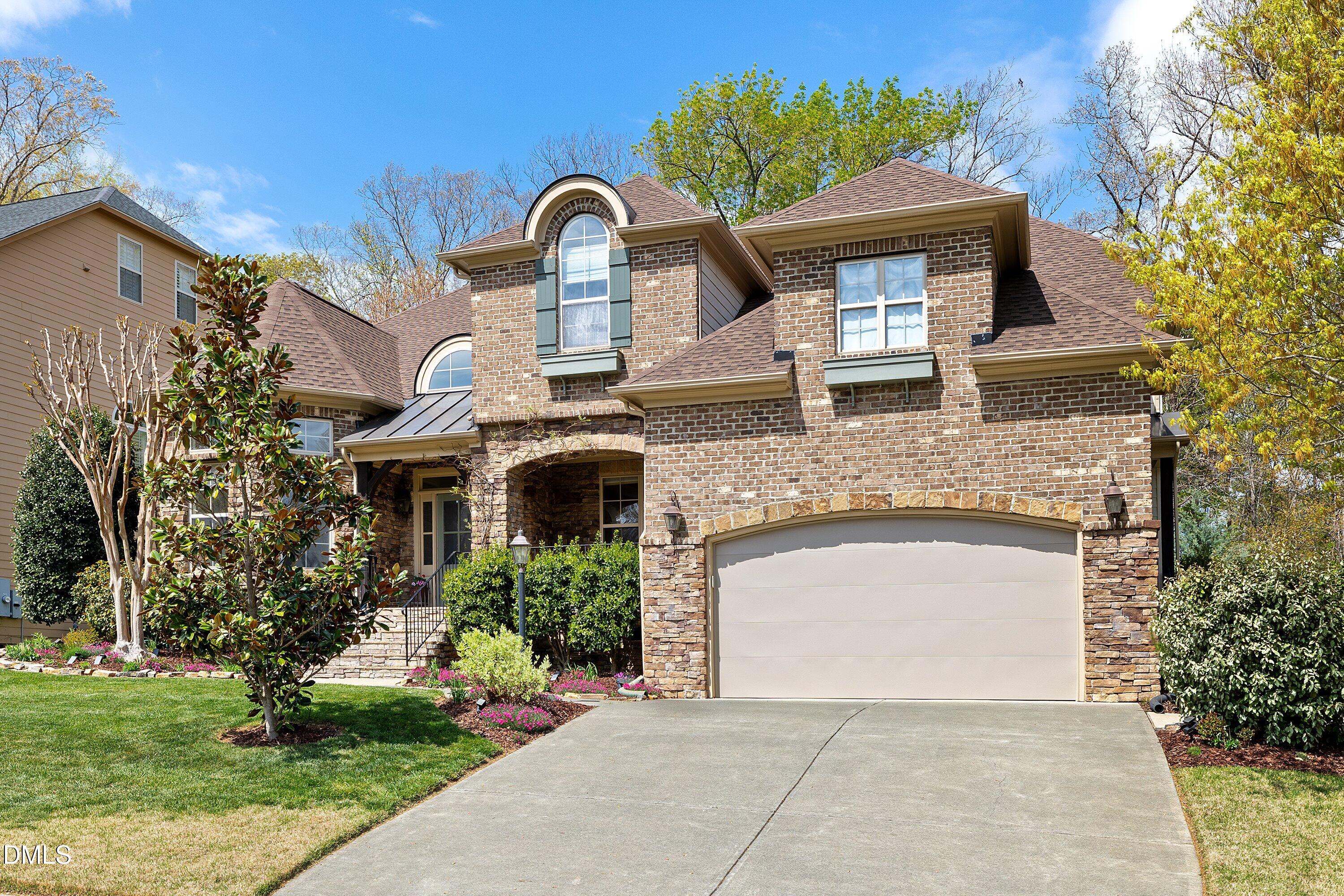 701 Royal Tower Way Cary, NC 27513 - Photo 81 of 82 a front view of a house with a garden
