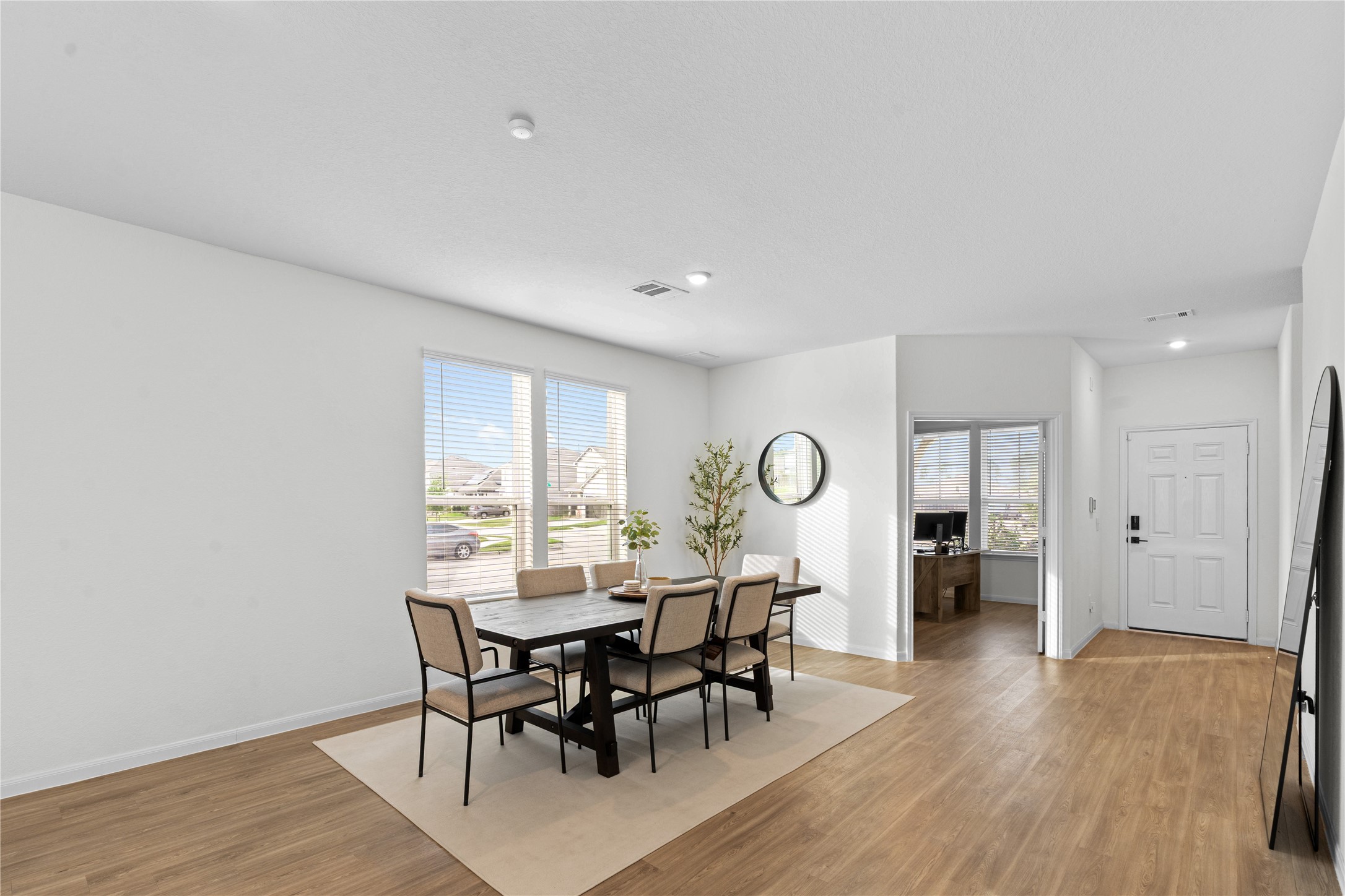 23439 Wrexham Street Spring, TX 77373 - Photo 12 of 26 a view of a a dining room with furniture window and wooden floor
