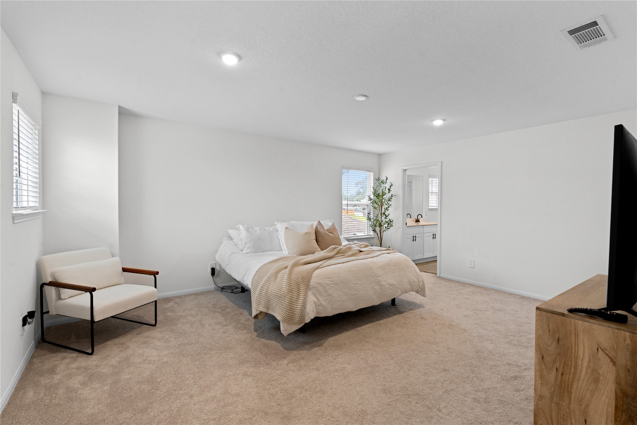 23439 Wrexham Street Spring, TX 77373 - Photo 19 of 26 a bed room with a bed and a chair