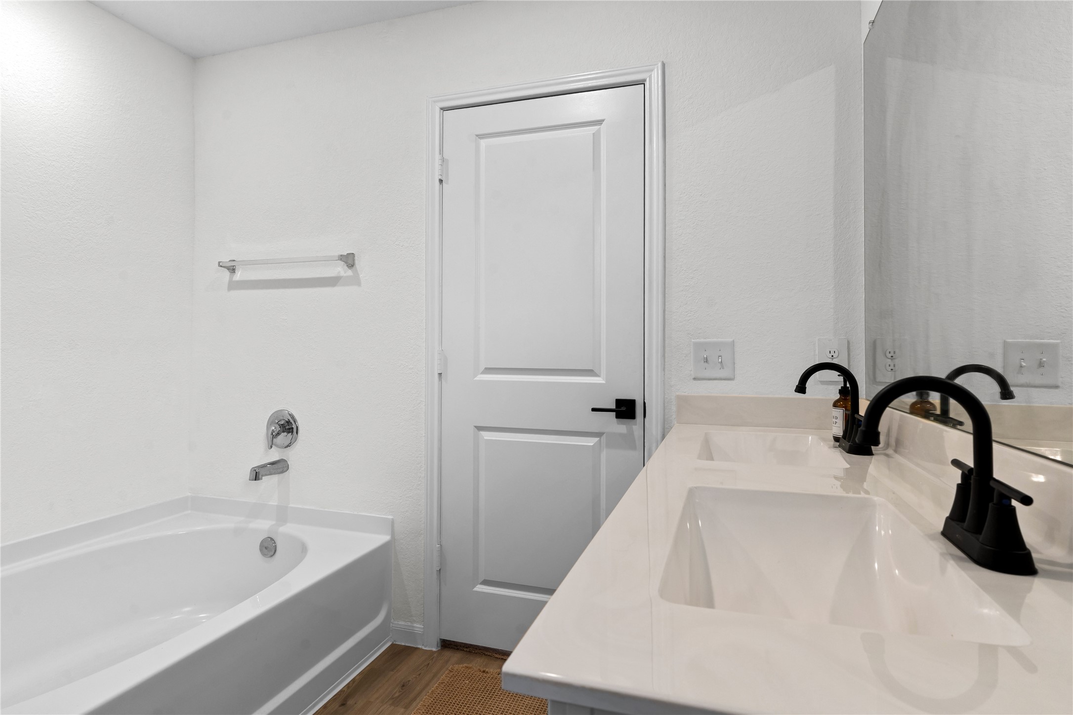 23439 Wrexham Street Spring, TX 77373 - Photo 20 of 26 a bathroom with a sink a bathtub and a window