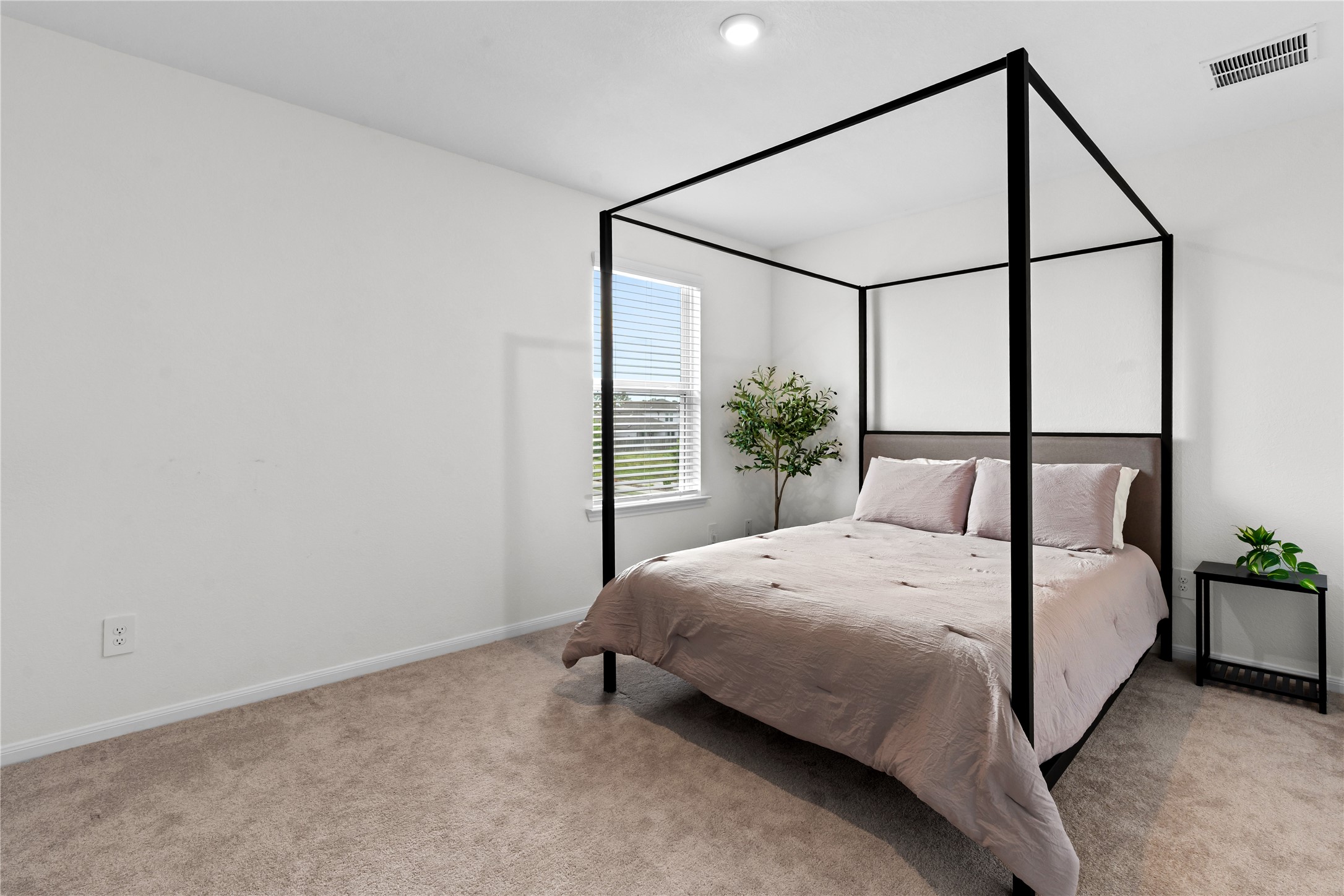 23439 Wrexham Street Spring, TX 77373 - Photo 21 of 26 a bedroom with a bed and a window