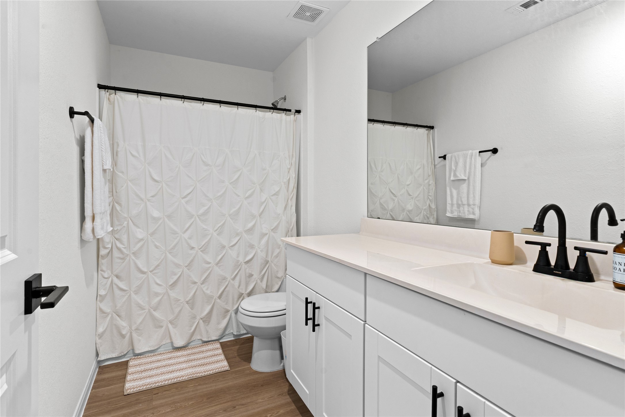 23439 Wrexham Street Spring, TX 77373 - Photo 22 of 26 a bathroom with a granite countertop sink toilet and shower