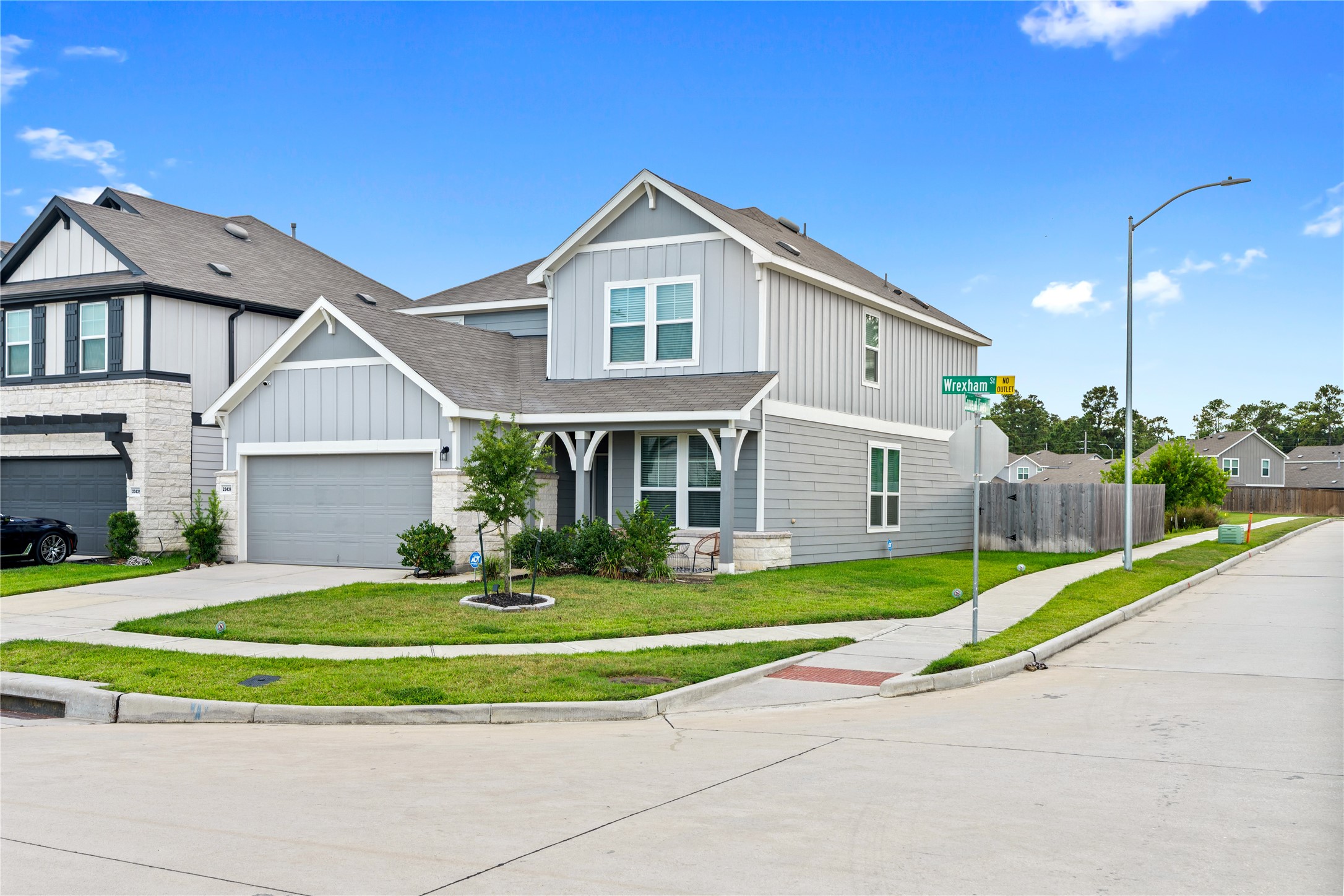 23439 Wrexham Street Spring, TX 77373 - Photo 26 of 26 a front view of a house with a yard and garage