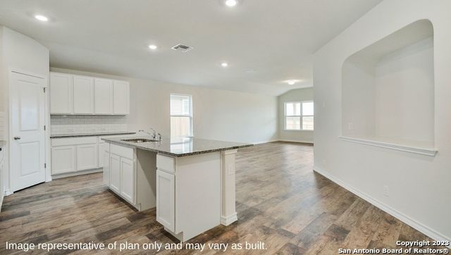 632 Fluted Shoals Cibolo, TX 78108 - Photo 3 of 24 a kitchen with white cabinets and sink