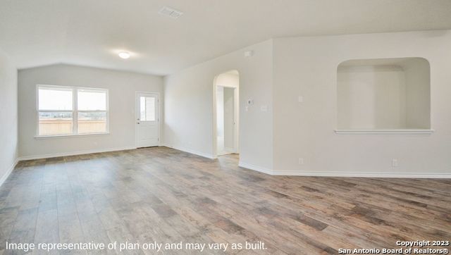 632 Fluted Shoals Cibolo, TX 78108 - Photo 6 of 24 an empty room with wooden floor and windows