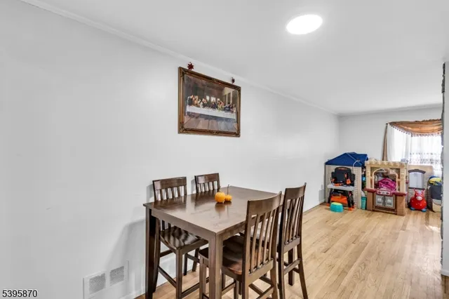 a view of a workspace with furniture and wooden floor