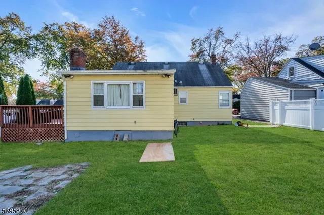 a view of a house with a backyard
