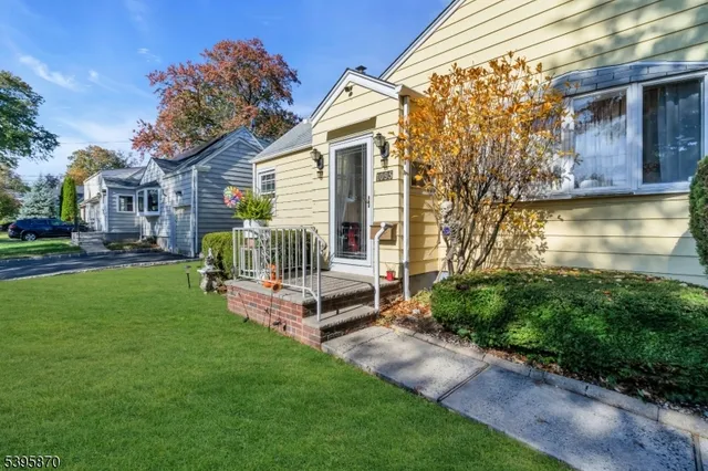 a view of a house with a yard porch and sitting area
